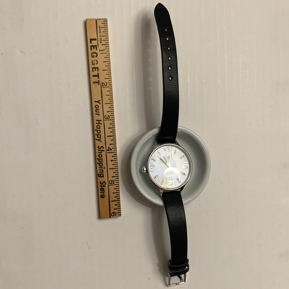 Working watch with black band and opalescent face